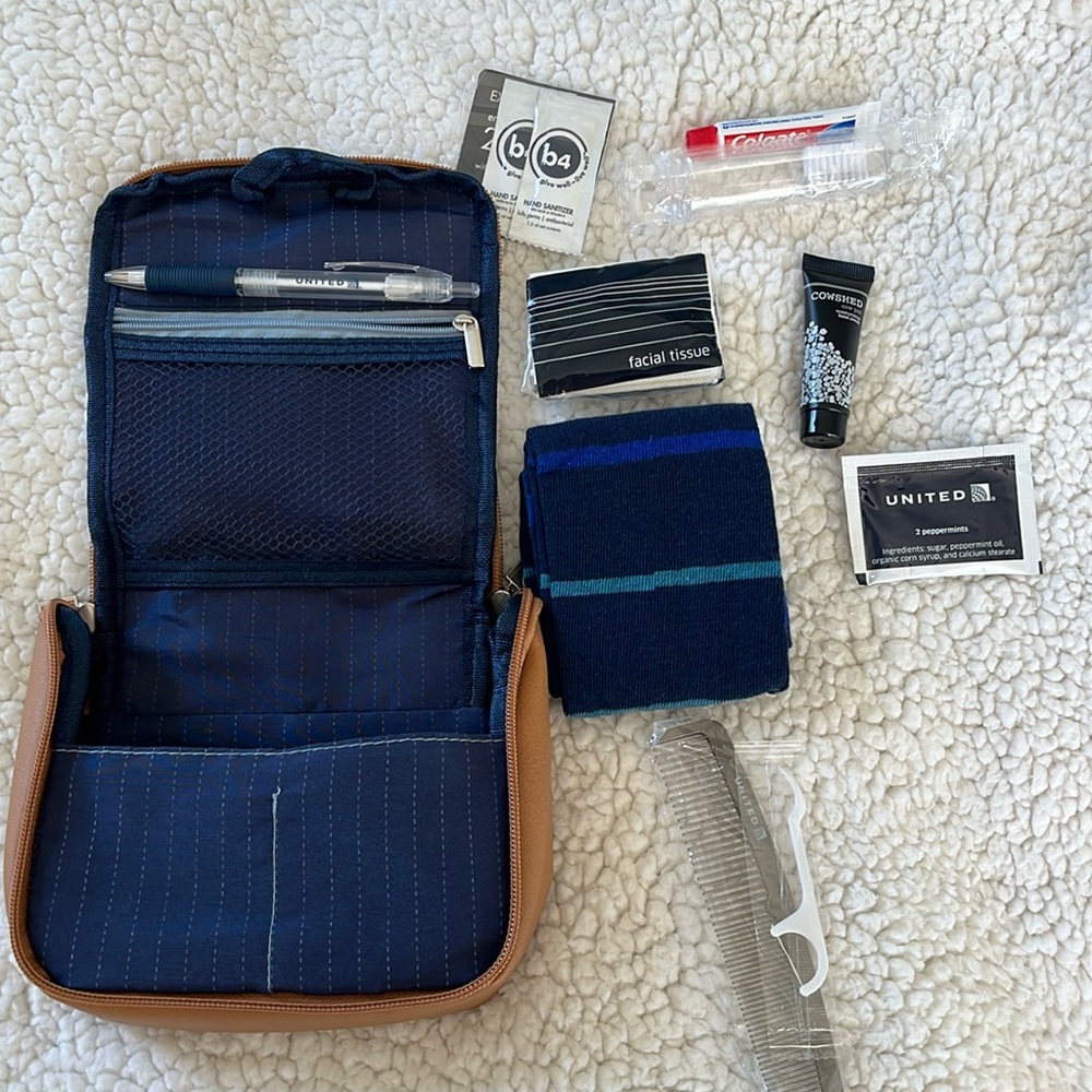 United Airlines Amenity Kit 2. Brown faux leather, most items in kit